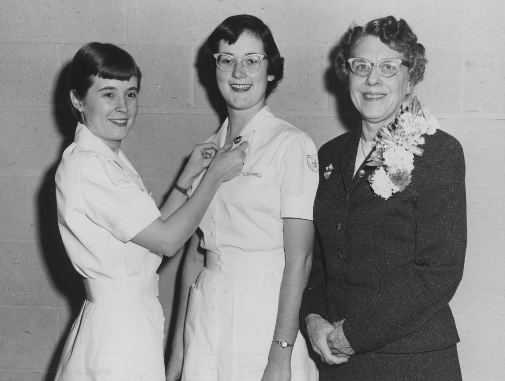 A junior physical therapy student receives her pin, January 1957